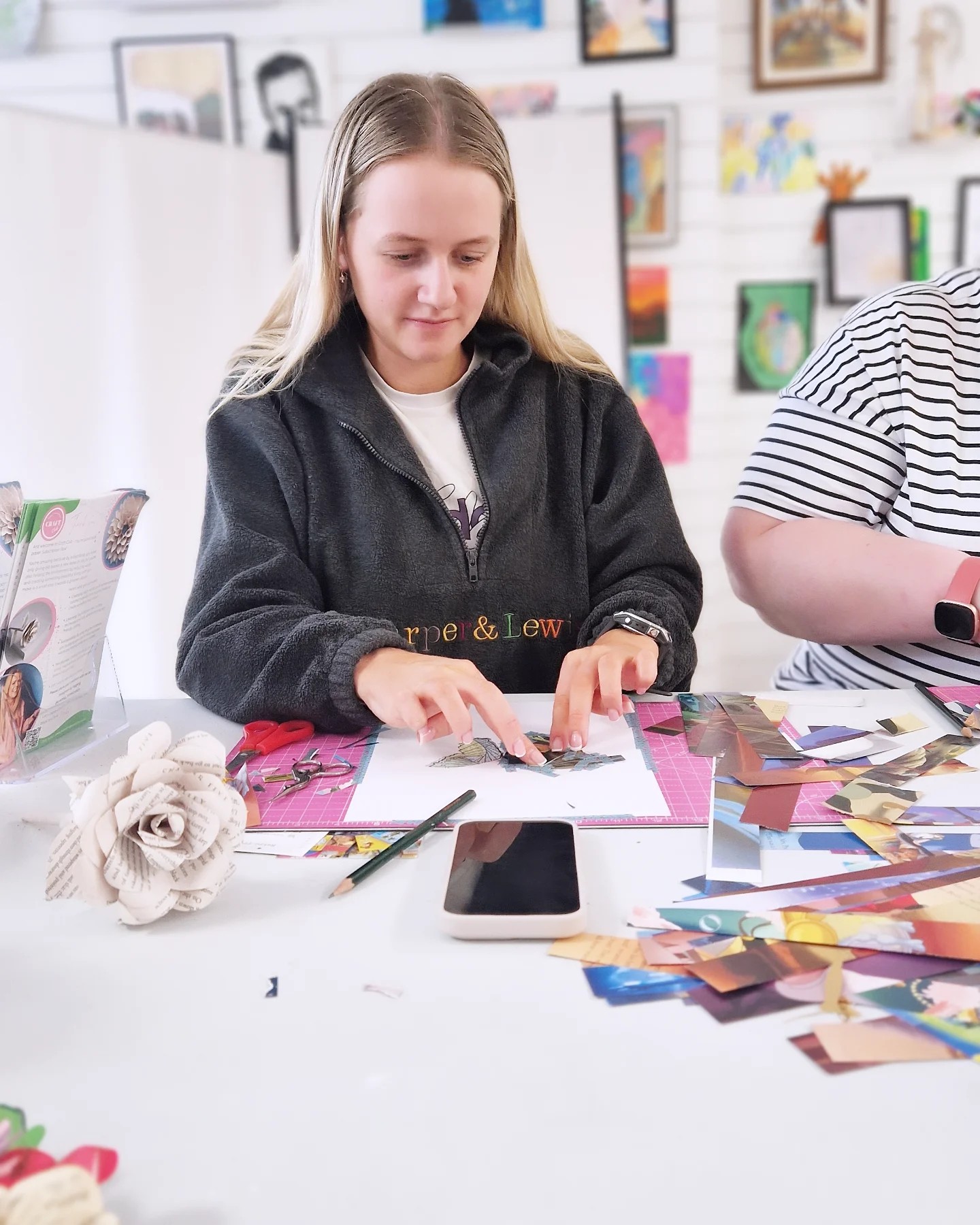 Woman is making art using old books