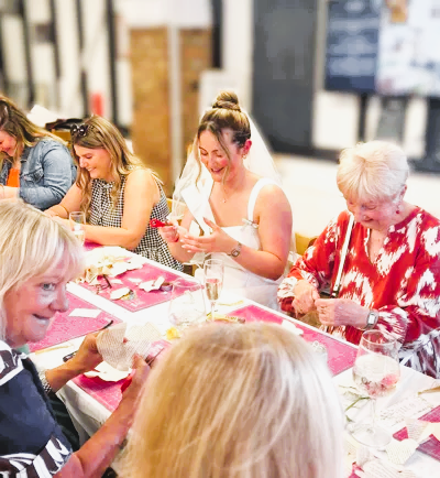 Bride to be crafting book roses on her Hen Party